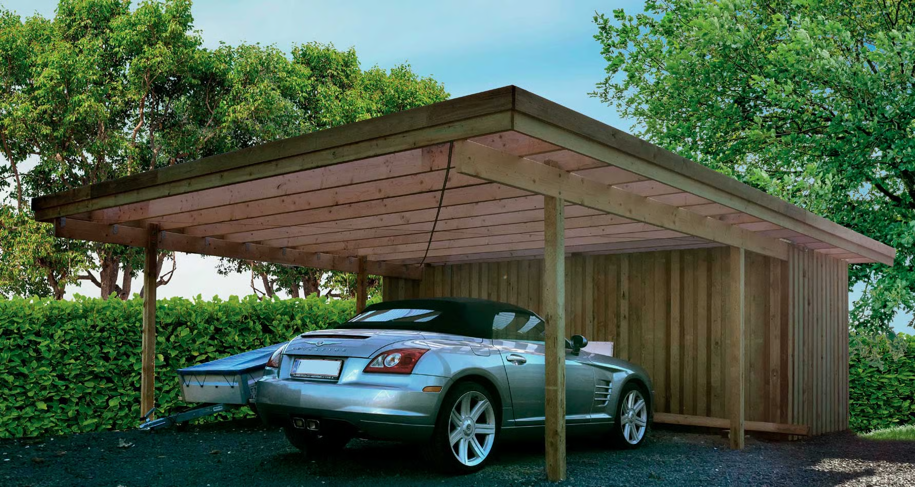 Billed af carport med bil og trailer